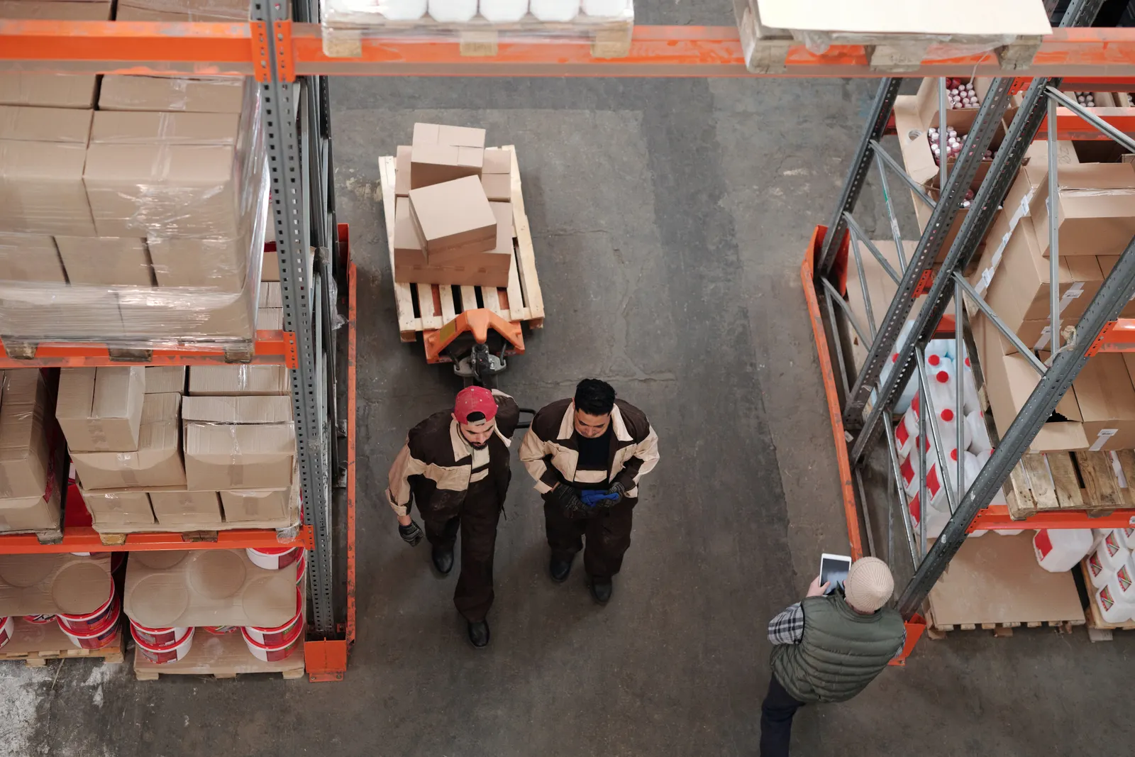 Warehouse professionals coordinating inventory and trade distribution