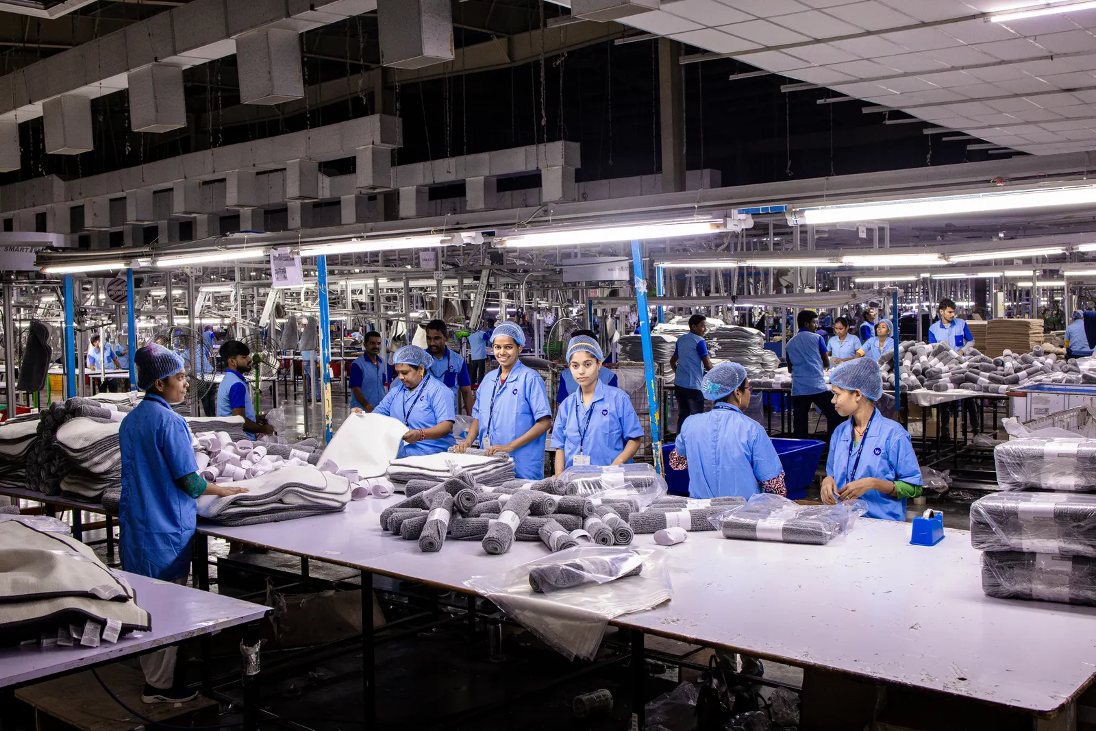Factory teams preparing manufactured textile products